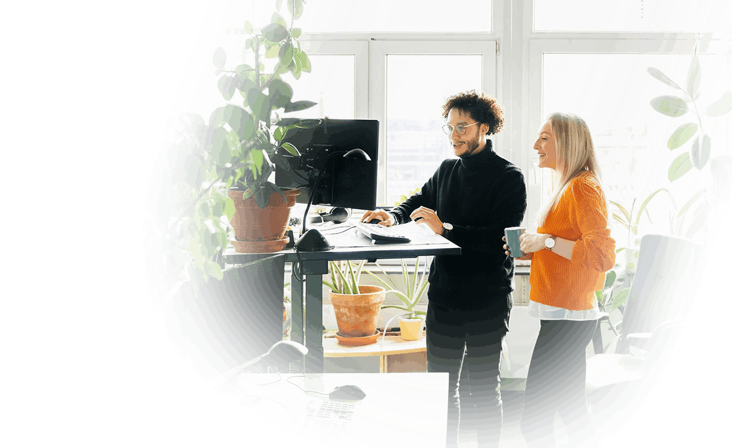 MPG-PPT-Cover-Symbol-16x9-man-woman-standing-work-station-green-plants-fade